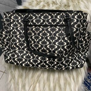Black and white Authentic Coach multifunctional bag.